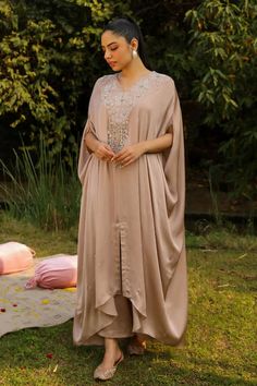 Beige kaftan with embroidered floral patterns and sequin bead tassel embellishments. Comes with a palazzo. - Aza Fashions Traditional V-neck Kaftan For Wedding, V-neck Kaftan With Dabka Work For Wedding, Wedding Georgette Kaftan With Dabka Detailing, Maxi Length Georgette Kaftan With Resham Embroidery, Wedding Kaftan With Mirror Work And Traditional Drape, Wedding Dabka Kaftan In Georgette, Bohemian Unstitched Kaftan For Wedding, Elegant Georgette Kaftan For Eid, Unstitched Kaftan For Wedding And Eid