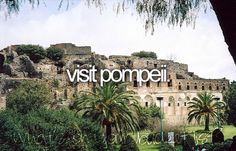 the words visit pompeii are in front of an old castle