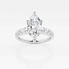 an oval cut diamond ring with side stones