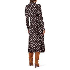 Black printed jersey (95% Viscose, 5% Elastane). Wrap. Long sleeves. High neckline. Wrap closure. 46" from shoulder to hemline. Imported. Printed Fitted Viscose Maxi Dress, Printed Midi Dress For Workwear In Fall, Printed Midi Dress For Fall Workwear, Fitted Patterned Midi Dress For Fall, Printed Fall Midi Dress For Workwear, Fitted Printed Maxi Dress For Work, Fitted Patterned Dresses For Fall, Fall Workwear Printed Midi Dress, Fitted Belted V-neck Wrap Dress