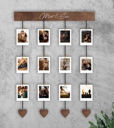 a family photo hanging on a wall with heart shaped magnets and wooden hangers