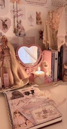 a doll is sitting on top of a table next to a mirror and other items