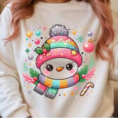 a woman with pink hair wearing a christmas penguin sweatshirt