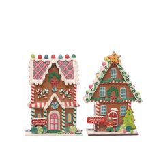 two gingerbread houses are shown on a white background