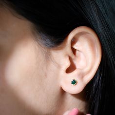 Product Details These simple yet classic Stud Earrings are designed with Round Shape Created Emerald in Bezel Setting. Become the center of attraction by wearing these Fine Earrings, secured with Screw Back Closure. Product Information SKU SHP-EARRINGS042168614 Length 4.6 mm Width 4.6 mm Weight 1.04 gm (Approximate) LAB CREATED EMERALD INFORMATION No.of Stones 2 Pieces Total Weight 0.54 Carat (Approximate) Dimension(approx) Round-4X4 mm-2 Pcs Color Green Cut Brilliant Shape Round Setting Type Be Lab Created Emerald, Solitaire Studs, Signature Jewelry, Emerald Earrings, Timeless Jewelry, Fine Earrings, Free Jewelry, Bezel Setting, Round Shape