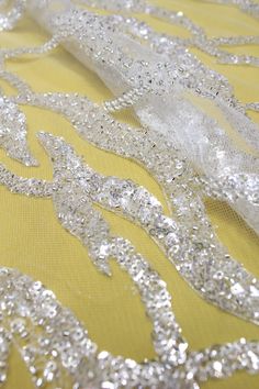 Welcome to Sunny shop. 1Yard Beads Lace Fabric For Bridal Dress, Veil Lace Fabric , Wedding Dress 3D Beaded Lace, Couture Tulle Sequins Lace Fabric, Mesh Lace This lace has an amazing look and is really very heavy. It is perfect the the most unique bridal dresses. Width about: 51inch (130Centimeters) Length : 91.44 Centimeters/ 1Yard Yarn: Transparent poly yarn Mesh: Nylon - off white Sequins: YES - Crystal Beads: YES - Silver Color: off-white+ Silver 30247# Price is set for one yard. You will r Embellished Tulle Sequin Fabric For Wedding, Wedding Embellished Tulle Sequin Fabric, Glamorous White Wedding Dress For Reception, White Glamorous Sequin Fabric With Rhinestones, Glamorous White Sequin Fabric With Rhinestones, Glamorous Embellished Sequin Fabric For Wedding, Wedding Lace Tulle Fabric With Rhinestones, Wedding Tulle Lace Fabric With Rhinestones, White Sequined Tulle Wedding Dress