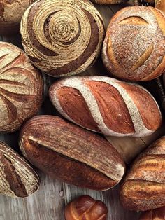 breads, loaves and rolls on a wooden table