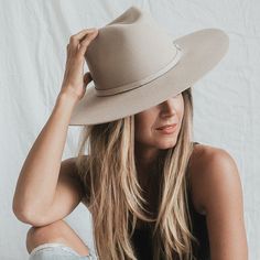 MINIMALIST NEUTRAL TONE IN HIGH-QUALITY SHEEP'S WOOL... This classic Rancher hat design is delicately HANDCRAFTED from sheep's wool, has a wide 4” brim, and has a traditional pinched high crown. Finished with a monochromatic quarter-inch wool removable band for a subtle, minimalist touch. This wool hat features a modern twist on a traditional style, leaving you warm in the winter or dry in the summer. 100% Mexican Sheep's Wool Teardrop and dove pinch crown Monochromatic Sheep's Wool band Extra c Winter Cream Fitted Fedora, Winter Beige Flat Brim Fedora, Wide Brim Beige Felt Hat For Winter, Beige Brimmed Felt Hat For Winter, Beige Wool Felt Hat For Fall, Beige Wide Brim Felt Hat For Winter, Beige Flat Brim Felt Hat For Winter, Classic Beige Panama Hat For Winter, Beige Wide Brim Fedora For Winter