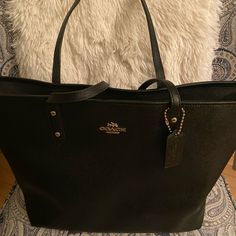 Large Coach Bag. Leather, Like New Condition A Zipper On Inside And A Cell Phone Pocket On Back. Excellent Bag That Can Carry Almost Everything. Black Coach Shoulder Bag With Top Carry Handle, Black Coach Shoulder Bag In Coated Canvas, Coach Shoulder Bag With Top Carry Handle For On-the-go, Coach Tote Shoulder Bag With Gunmetal Hardware, Coach Coated Canvas Bag For On-the-go, Leather Coach, A Cell, Coach Bag, Coach Bags