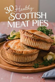 two meat pies on a wooden plate with the title overlay reads 30 healthy scottish meat pies