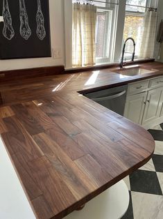 a kitchen with an island made out of wood