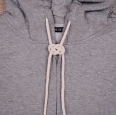 the hoodie is tied up and ready to be worn