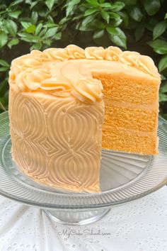 a cake on a glass plate with a slice missing