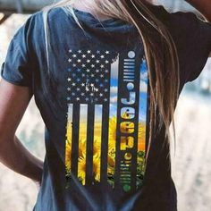 the back of a woman's shirt with an american flag on it