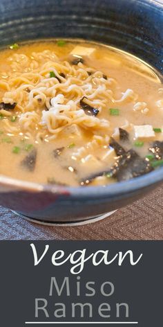 a blue bowl filled with soup and noodles