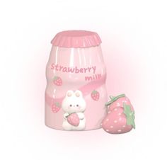 a plastic strawberry milk bottle next to a strawberry shaped toy with the word strawberry milk written on it