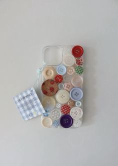 a cell phone case with buttons attached to it