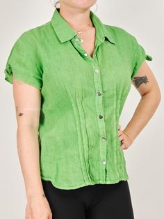 Beautiful green linen snap closure shirt. Sourced in Lisbon, Portugal.  Size: N/A Measurements lying flat: Width: 18" Length: 22" Shoulder to Shoulder: 16" Condition: Very Good.  Material: N/A Feels like a linen blend.  For reference, Model is 5'4", Bust 34", Waist 25", Hip 35.5" Items are pre-loved and may come with some minor flaws. We are advocates of buying secondhand and hope that you can love the character of these garments as much as we do! https://www.instagram.com/renouxshop/ https://ww Green Collared Top With Snap Buttons, Casual Green Shirt With Snap Buttons, Green Button-up Shirt With Snap Buttons, Green Spring Tops With Snap Buttons, Classic Linen Tops With Snap Buttons, Spring Green Shirt With Snap Buttons, Relaxed Fit Linen Tops With Snap Buttons, Green Shirt With Snap Buttons For Spring, Green Linen Button-up Blouse