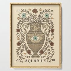 an ornate vase with the eye of aquarius surrounded by leaves and flowers framed on a wall