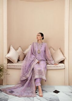 Pakistani Salwar Suit Dupatta Embroidered Lilac Salwar Kameez is a perfectly stitched masterpiece that has the perfect balance of royalty and grace. The Kameez Salwar comes in an alluring lilac shade that will steal everyone's hearts at the very first glance with its charm and elegance. Embroidered Kameez: The Pakistani Salwar Kameez has an alluring lilac shade and it comes in a premium tissue fabric. Hand-crafted details of pearls and motifs enhance the glamour of this embellished kameez. Elega Pakistani Salwar Suit, Suit Dupatta, Dupatta Border, Desi Fits, Wedding Dress Bustle, Pakistani Salwar, Organza Sleeves, Pakistani Wedding Outfits, Desi Clothes