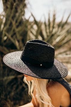 Our Palm Desert Panama fit in perfectly on our latest road trip photo shoot. Stunning, classic, chic - everything you've ever wanted in a hat. Featuring a molded crown with a pinched 10cm brim and hand woven straw, it's crystallized on the tone on tone ribbon with a simple Swarovski rivet. -Rancher style hat with a chill & casual vibe-Brim is flexible but holds its shape-Coordinating ribbon band-Pinched top-Great quality-- will last forever-This color actually goes with everything effortlessly-A Black Straw Panama Hat For Travel, Black Brimmed Toquilla Straw Hat, Black Toquilla Straw Hat With Curved Brim, Black Straw Hat With Flat Brim, Vacation Hat With Structured Crown, Adjustable Structured Crown Hat For Vacation, Black Wide Brim Toquilla Straw Hat, Black Toquilla Straw Hat With Flat Brim, Black Flat Brim Toquilla Straw Hat