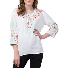 Raj Dahlia Tunic This elegant tunic is ready to make a statement with detailed floral embroidery and beautiful tassels to add on-trend interest. Pair with your favorite jeans and you're ready to go! Casual Tunic Top With Tassels, Spring Bohemian Top With Embroidered Hem, Floral Embroidered Top For Fall Vacation, Floral Embroidered Top For Vacation In Fall, Casual Floral Embroidery Peasant Tunic Top, Bohemian Spring Embroidered Tunic Top, Spring Floral Print Tunic Peasant Top, Spring Floral Print Peasant Tunic Top, Spring Peasant Top With Multicolor Embroidered Neckline