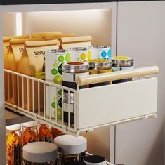 an organized pantry with canned food in containers and cans on the bottom shelf next to other kitchen items