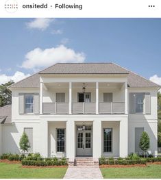 a large white house with columns and windows