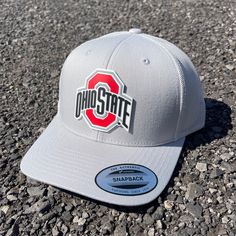 Our Pvc Patch Is A Waterproof, Rugged, And Clean Looking Design. You Can Bet That This Patch Will Look Vibrant For Years To Come. We Only Use The Highest Quality Products And Headwear. We Believe That Our Pvc Patches Beat Out Any Other Type Of Patch Offered On A Hat. Design: Ohio State Buckeyes Hat: Yp Classics Trucker Hat Color: Silver 65/35 Polyester/Cotton Matching Undervisor Structured, Mid-Profile, Six-Panel Mesh Back, Snapback Closure Crown Height: 3 1/2" Hat Size: 6 5/8 - 7 3/8 Nike Adjustable Snapback Trucker Hat, Nike Adjustable Trucker Hat, Adjustable Silver Snapback Baseball Cap, Silver Adjustable Snapback Baseball Cap, Silver Casual Snapback Hat, Casual Silver Snapback Hat, Nike Snapback Trucker Hat For Streetwear, Nike Adjustable Snapback Hat With Flat Bill, Nike Adjustable Flat Bill Snapback Hat