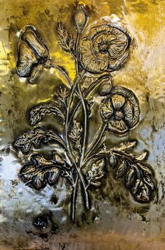 an abstract painting with flowers and leaves in gold, black and silver colors on a metal surface