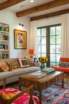 a living room filled with furniture and bookshelves next to a window covered in sunflowers