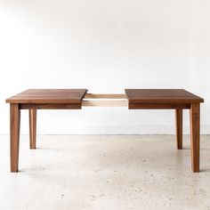 Extendable Tapered Leg Dining Table in solid Walnut / Clear