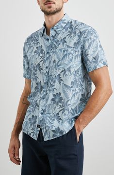 Made from a breezy linen blend, this short-sleeve button-up features a handy chest pocket and a tropical botanical print. 29 1/2" length; 44" chest Front button closure Point collar Short sleeves Chest patch pocket 55% linen, 45% viscose Curved hem Machine wash, line dry Imported Spring Linen Short Sleeve Beach Shirt, Blue Linen Short Sleeve Shirt For Spring, Spring Linen Short Sleeve Shirt For Beach, Summer Button-up Short Sleeve Shirt For Casual Gatherings, Casual Linen Tops With Floral Print, Vacation Linen Short Sleeve Shirt With Button Closure, Linen Short Sleeve Shirt With Button Closure For Vacation, Spring Linen Short Sleeve Shirt With Pockets, Spring Linen Short Sleeve Shirt With Rolled Sleeves