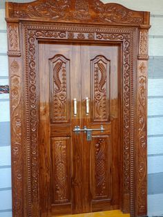 a wooden door with intricate carvings on it