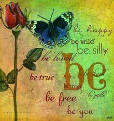 a blue butterfly sitting on top of a red rose next to a quote that says be happy