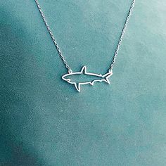 "Silver Shark Necklace For Women, Handmade Simple Shark Jewelry Gift. ✅ PRODUCT DETAILS * Material: solid sterling silver. * Pendant is 1.3mm thick. * The total length is the chain length only, it does not include the length of the charm. * All necklaces come with a 2\" extender for adjustable length. ✅ PRODUCTION & SHIPPING INFO 📌 Important: please be aware that the shipping time does not include the production time. 1. Production time: each piece is individually handmade and will be ready Cute Jewelry Silver, Shark Things, Shark Accessories, Shark Stuff, Shark Jewelry, Silver Shark, Jewelry Ocean, Surf Jewelry, Shark Gifts