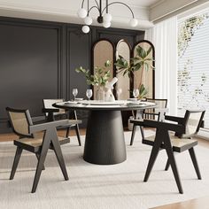 a dining room table with four chairs and a vase on the top, in front of a large window