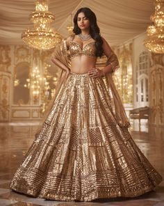 This lehenga set features antique gold sequin embroidery in a geometric pattern. The blouse shows crystal tassels at the waist. Embroidered dupatta also shows crystal tassels on all four sides.From Seema Gujral's Inara collection. DELIVERY TIMEPlease allow 8-12 weeks for your outfit to arrive. FABRIC DETAILSNet Professional cleaning only. Crystal Lehenga, Sequin Lehenga, Seema Gujral, Sweetheart Bridal, Gold Lehenga, Crazy Dresses, India Clothes, Organza Shirt, Organza Blouse