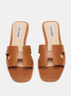 Look trendy and comfortable in this cognac sandal by Steve Madden. Cut-out details create an edgy appeal to the leather sandal, completed by a square open toe. Trendy Sandals 2024, Trendy Flats For Women, Steve Madden Hadyn, Cognac Sandals, Trendy Flats, Trendy Sandals, Chill Outfits, All About Shoes, Italy Vacation