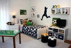 a soccer themed bedroom with black and white decor