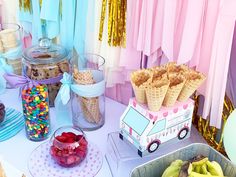 a table topped with lots of food and desserts