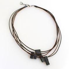 Leather Necklace - Fun and easy to wear, this multi-strand necklace is a go to, everyday favorite! Italian leather cords are adorned with sculptural sterling silver elements.Finished with a sterling silver lobster claw clasp and links for adjustable comfort.Interior length adjusts 17-18.5, exterior length drapes to 19 to 20. Elegant Leather Necklace For Everyday Use, Artisan Leather Necklace For Everyday, Elegant Leather Necklace For Everyday, Handmade Leather Necklace In Brown, Rustic Adjustable Leather Necklace, Luxury Modern Leather Necklace, Artisan Brown Leather Necklace, Jewelry Packaging Design, Artful Home