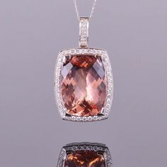 A gorgeous 39.82 carat morganite accented with 1.57 carats of white diamonds. All set in 18k white gold. Dimensions are 48.3mm x 27.5mm x 14mm Morganite Jewelry, Birthday Babe, Halo Pendant, Diamond Pendant Necklace, Gorgeous Jewelry, Custom Engagement Ring, White Diamonds, Morganite, Diamond Pendant