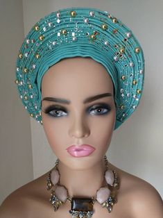 Teal colored embellished Asoke. Traditional Headwrap For Party, Traditional Party Headwrap Headband, Traditional Party Headwrap, Traditional Fitted Headscarf, Traditional Party Headwrap One Size, Traditional Adjustable Turban For Parties, Traditional Adjustable Headwrap For Party, Adjustable Traditional Headwrap For Parties, Traditional Adjustable Headscarf For Wedding