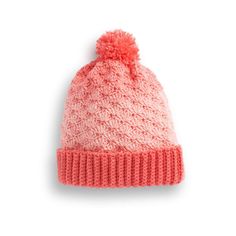 a pink knitted hat with a pom - pom on the top and bottom