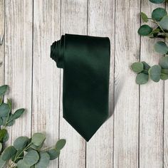 Our emerald necktie is the PERFECT choice for weddings, groomsman gift, groomsman proposal neckties, olive green wedding, olive ties for men, groomsmen gift, or any other special occasion!Looking for a matching bowtie? Click here for our emerald satin bow tie.Want to be 100% certain about the color? Simply order a color swatch and we will get one in the mail for you! Click here: https://theboldbowtie.com/search?q=swatch**Care Instructions**~Spot clean with warm water~Not intended for sleep~Do no Black Suit Dark Green Tie, Formal Green Ties, Green Formal Neckwear With Ties, Elegant Green Formal Neckwear, Classic Green Suit And Tie Accessories, Classic Green Ties For Black Tie Events, Classic Green Ties For Black Tie Occasions, Classic Green Tie For Black Tie Occasions, Solid Wedding Neckwear With Ties