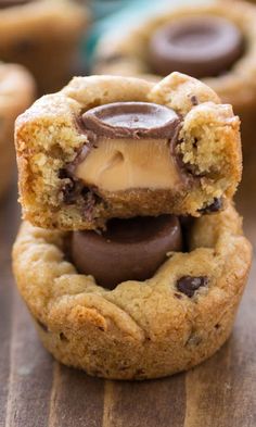 two cookies with peanut butter and chocolate fillings are stacked on top of each other