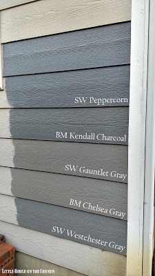 the side of a house with different types of siding on it and names painted on them