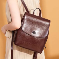 Women's Top Grain Leather Backpack Simple Style City Backpack Natural Cowhide Leather Rucksack Classic Elegant Leather Backpack Model Number: SX886 Dimensions: 9"L x 4.7"W x 10.6"H / 23 cm(L) x 12 cm(W) x 27 cm(H) Weight: 1.87 lb / 0.85 kg Hardware: Silver Hardware Shoulder Strap: Adjustable Color: Brown / Coffee / Black Features: • Genuine Natural Leather• Inside 1 Wallet Pocket, 2 Zipper Pockets.• YKK Zipper• Adjustable Shoulder Strap• Can fit an iPad mini, iPhone, Books, Files, Mini Umbrella, Leather School Bag, Vintage Leather Backpack, Women Backpack Travel, Simple Backpack, City Backpack, Female Shoulder, Leather Rucksack, Simple Leather, Backpack Women