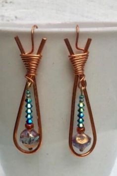 the earrings are made with copper wire and glass beads